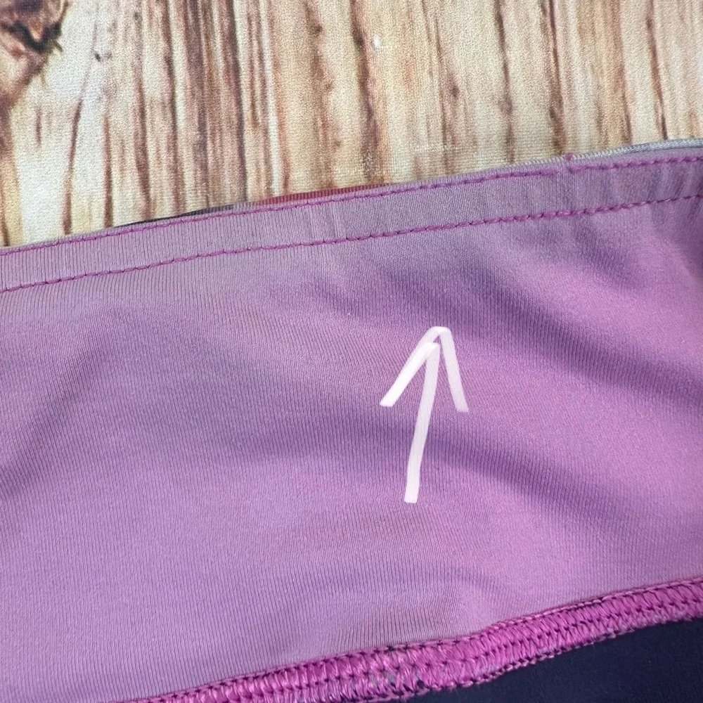 Lululemon Dark Navy ,colorful waist ban and slightly cropped leggings Size 8.